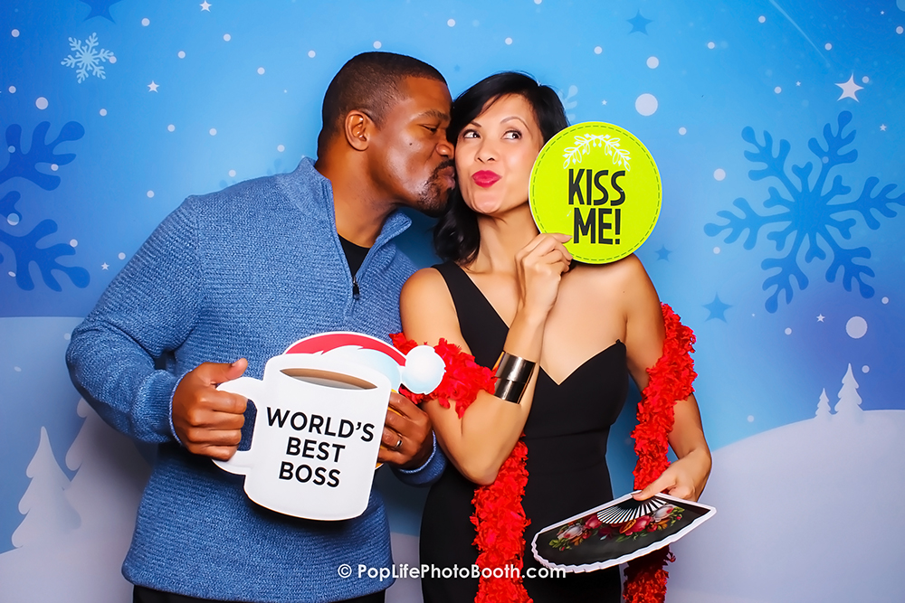 These two are having some kissing time with our Photo Booth in Front of our Winter Wonderland Backdrop in Wente Vineyard