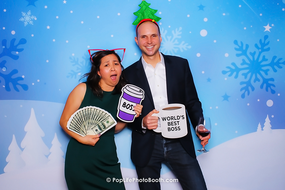 These two are having fun with our Photo Booth in Front of our Winter Wonderland Backdrop in Wente Vineyard