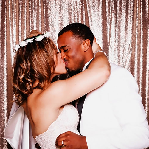 Wedding Photo Booth Sample - Kissing Newlywed - Champagne Sequins Backdrop
