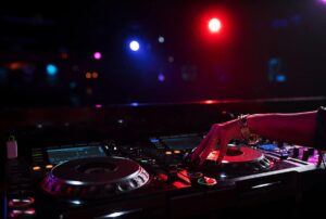 neon lit DJ table and event space at night