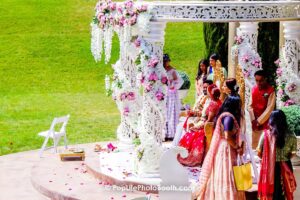 bridge and groom at the wedding ceremony with colorful flower decorations