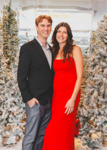 Harris law Christmas party couple red dress