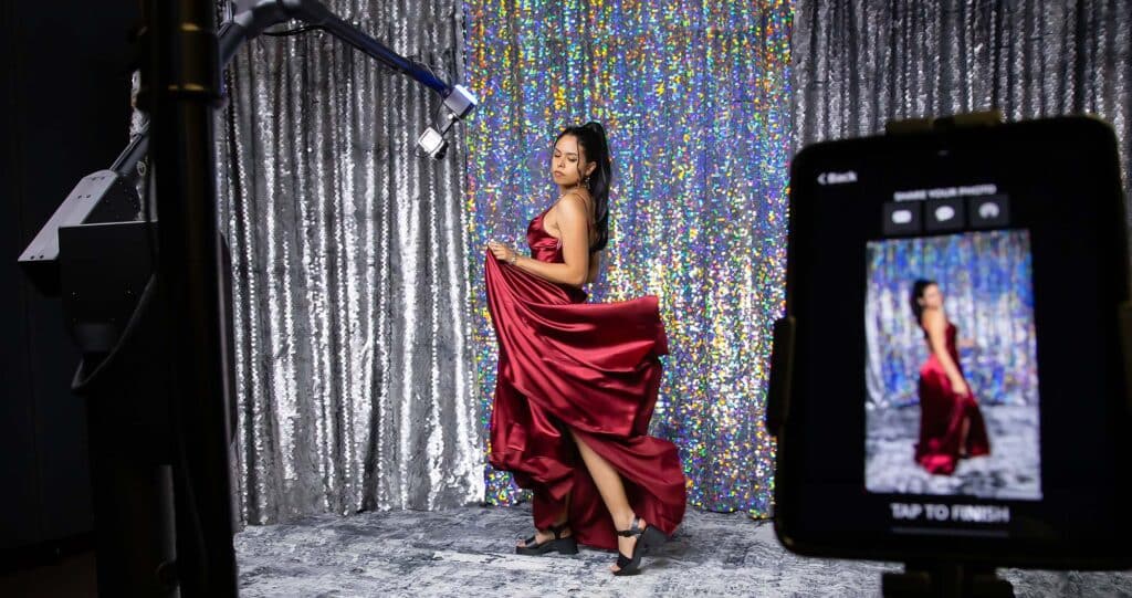 woman in flowing dress in a glambot booth rental