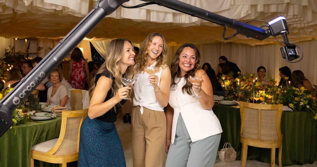 friends doing the glambot experience at a high end celebration