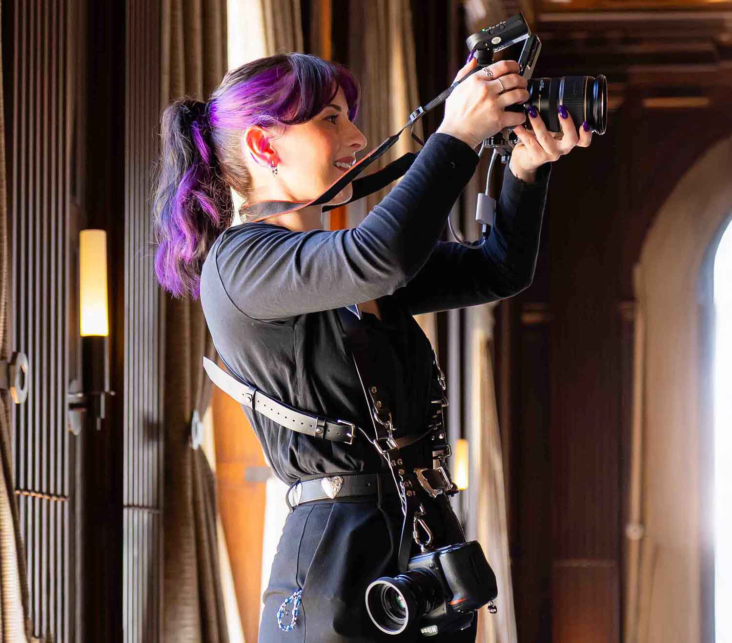 Photographer with cameras