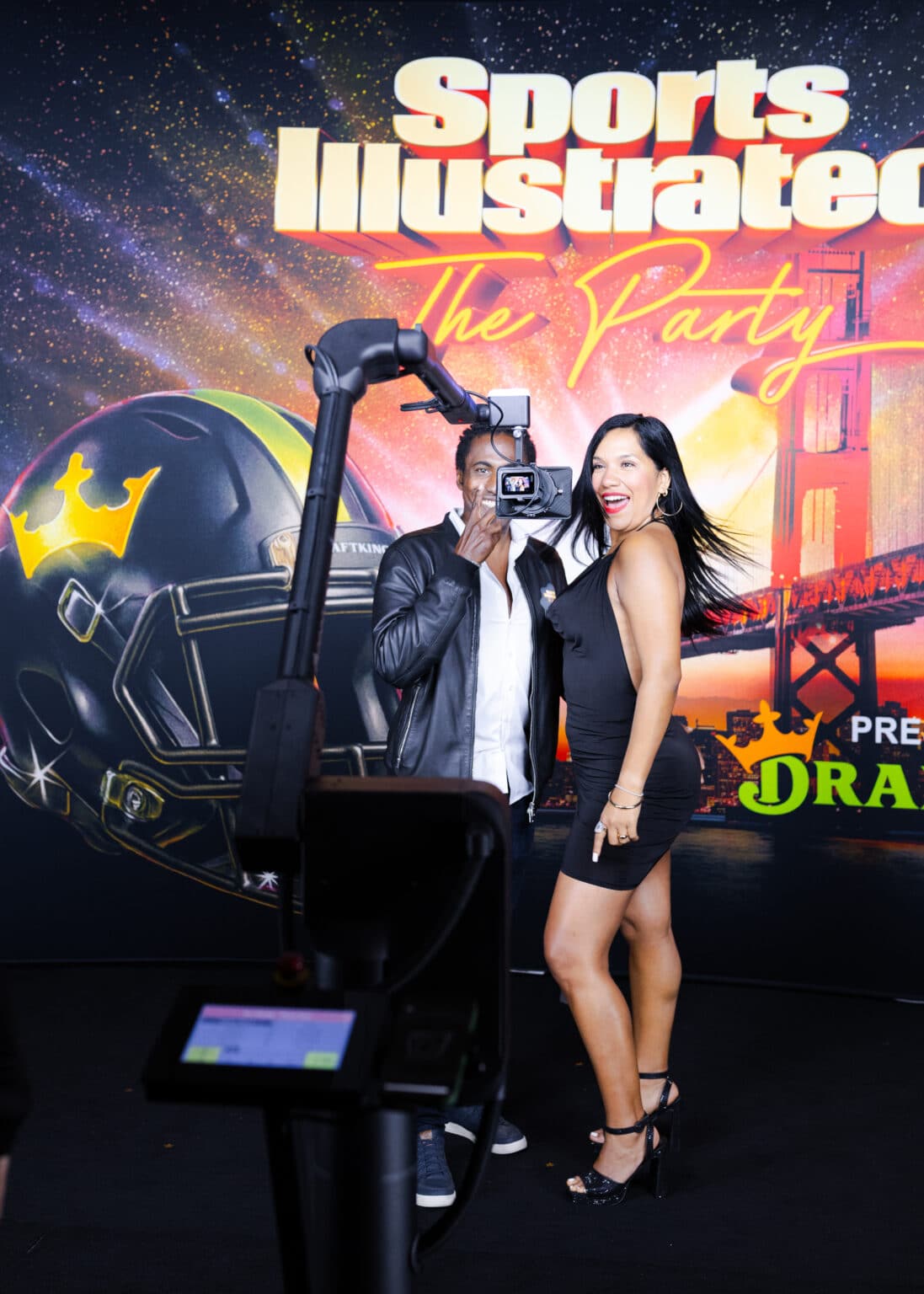 couple experiencing Pop Life Photo robotic slow motion video experience the Glambot-X