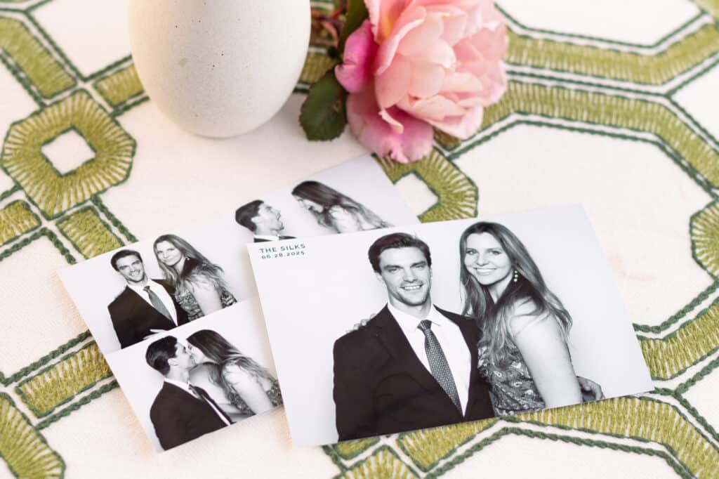 Printed photo booth black and white pictures set on a table