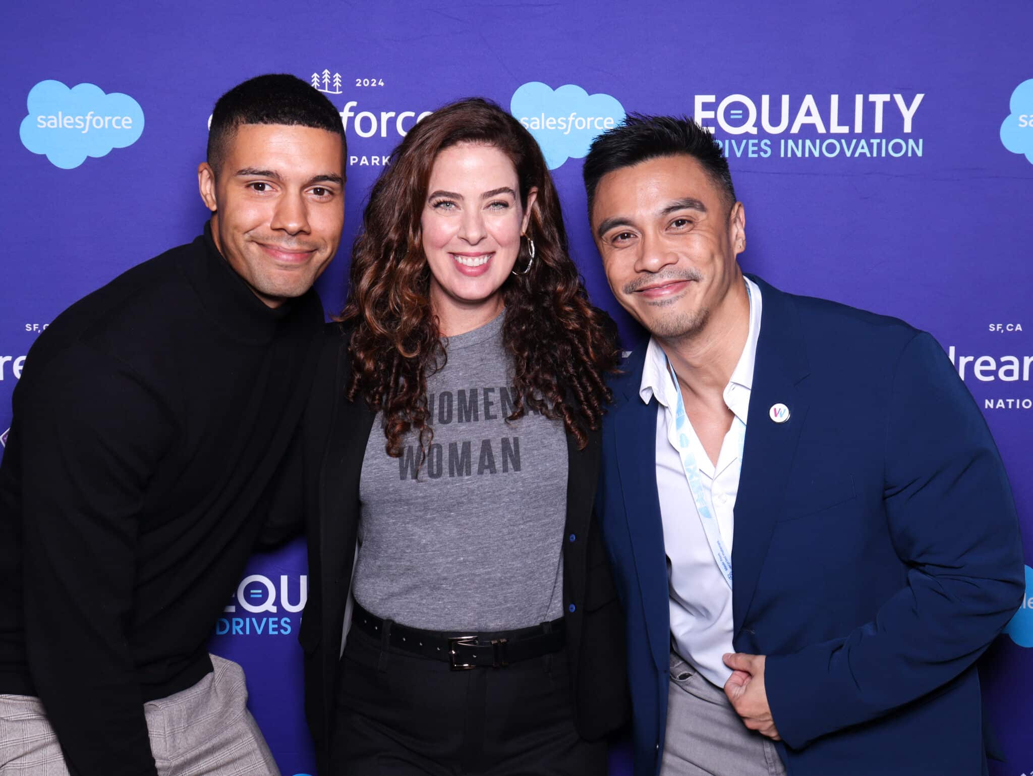 Branded photo booth experience at Salesforce Equality event, three people posing with branded backdrop and