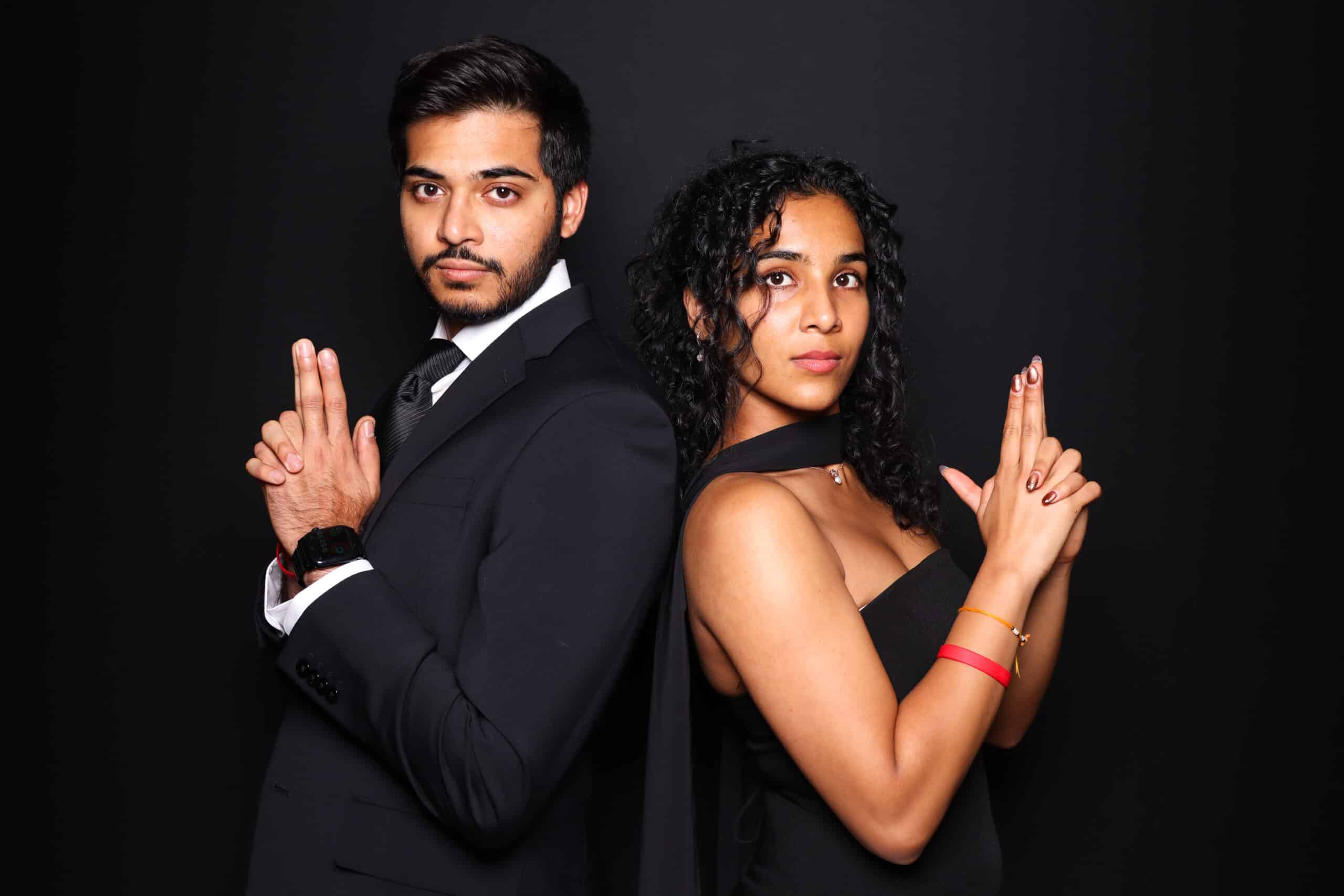 Branded photo booth experience with guests posing for a corporate event, professional lighting and backdrop.