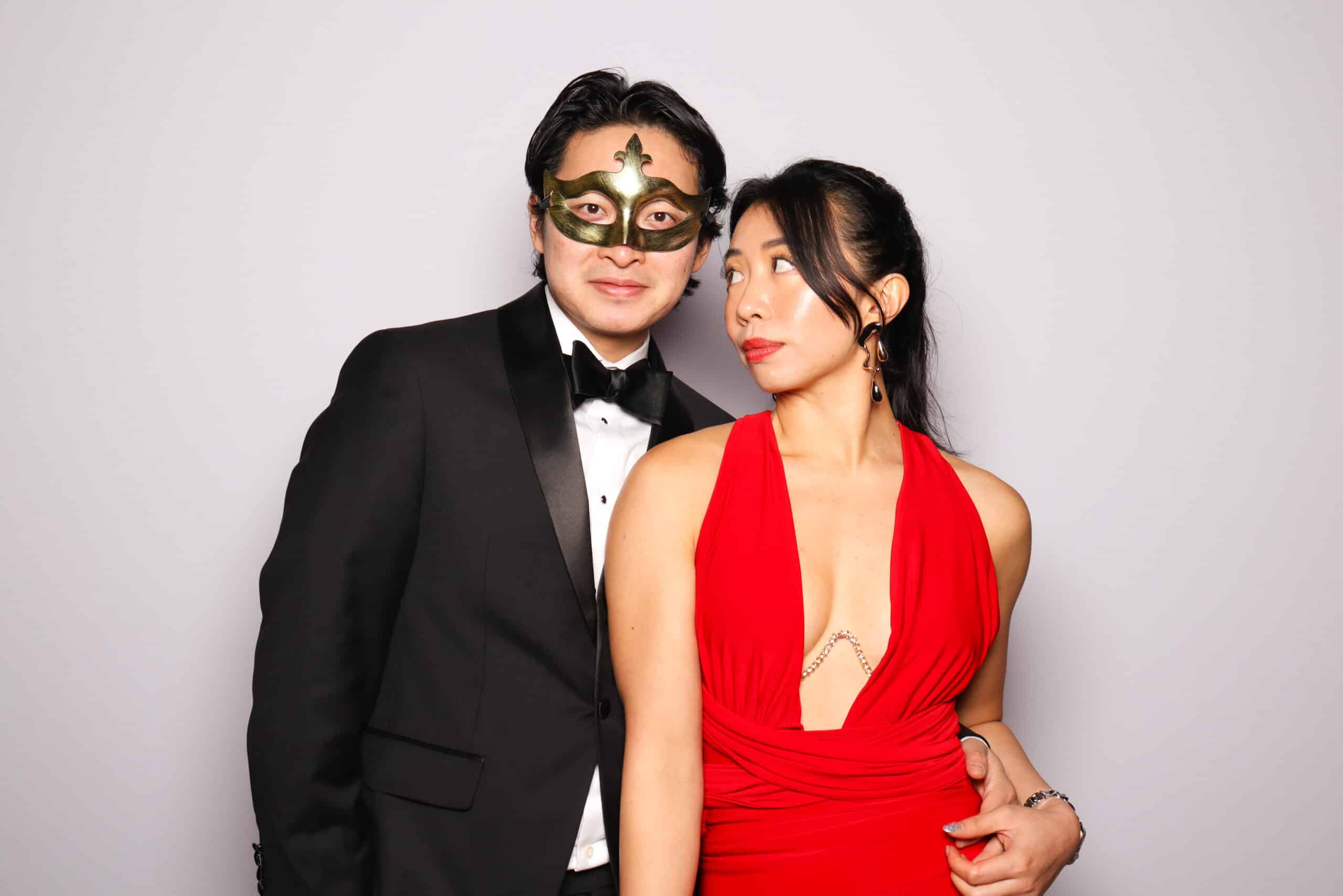 Photo of a couple during a masked party