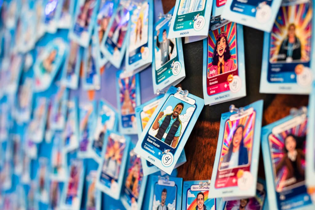 a wall of colorful custom AI trading cards from Dreamforce 2025