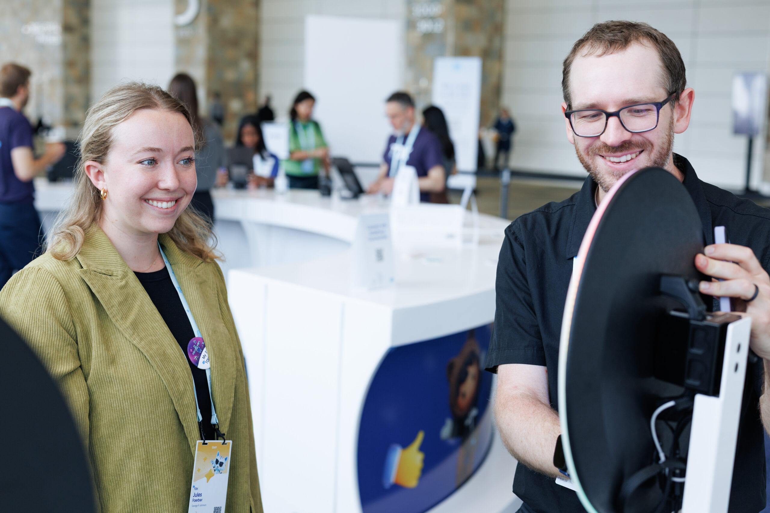Pop Life Photo attendant guiding guest through AI Trading Card experience at Salesforce TDX 2026
