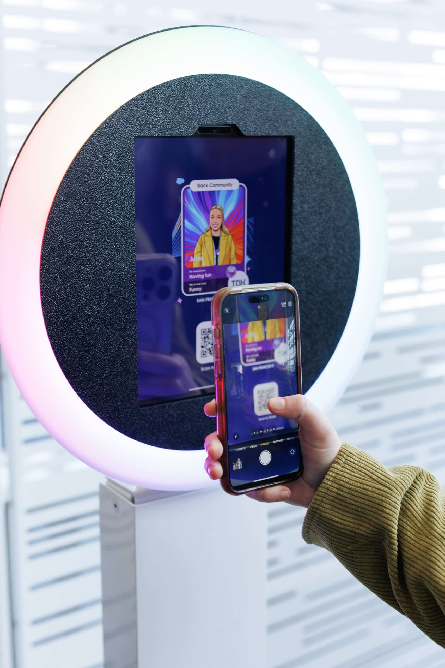 Attendee interacting with Pop Life Photo's AI Trading Card booth at Salesforce TDX 2026