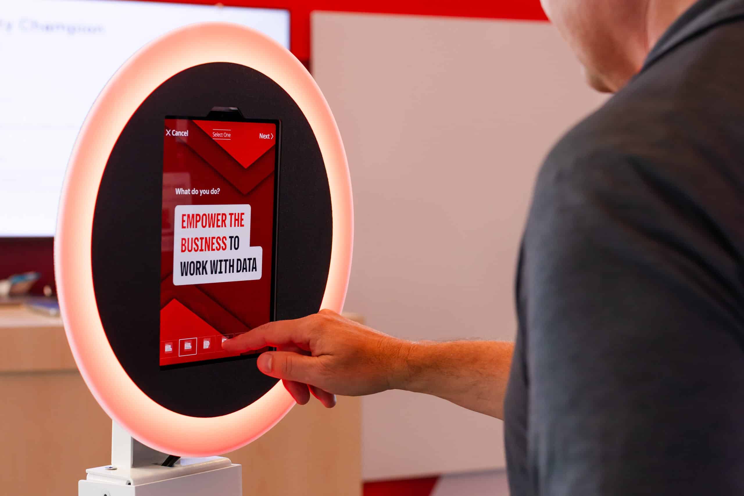 Man interacting with a photo booth touchscreen