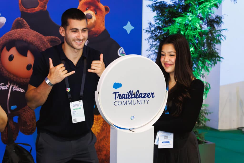 Man posing for a photo with a branded photo booth
